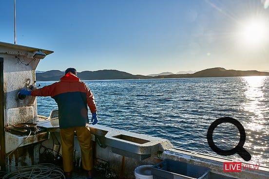  scots man qorking on boat 